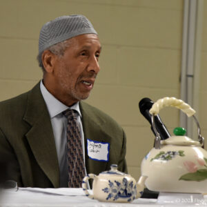 Imam Shafeeq Sabir speaks at the Teatime for Peace, an interfaith dialog for the members of  Masjid Bilal of Cleveland and the Community of Saint Peter, at the Masjid Bilal in Cleveland, Saturday, July 16, 2022. (Photo by Peggy Turbett.)