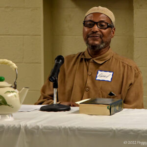 Imam Ahmed Saeed speaks to the gathering at Teatime for Peace, an interfaith dialog for the members of  Masjid Bilal of Cleveland and the Community of Saint Peter, at the Masjid Bilal in Cleveland, Saturday, July 16, 2022. (Photo by Peggy Turbett.)